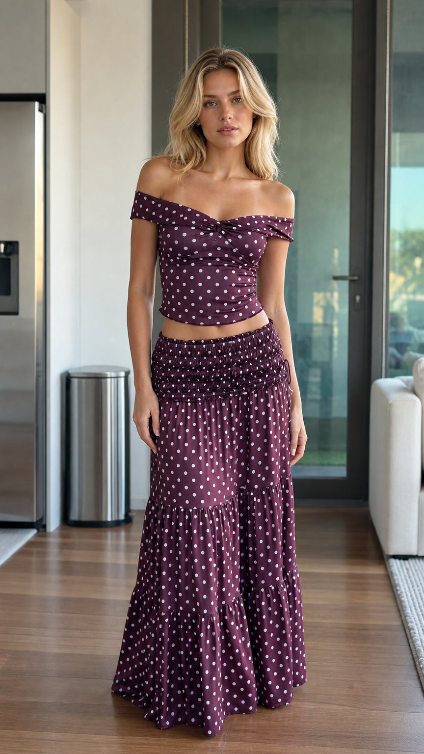 Front view of burgundy polka dot crop top and maxi skirt set