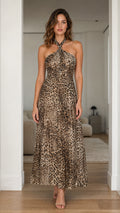 Front view of model wearing brown leopard print halter maxi dress