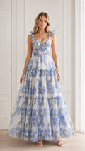 Front view of model wearing blue floral tie strap maxi dress