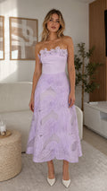 Front view of model wearing lavender 3D floral strapless midi dress