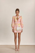 Front view of model wearing pink baroque print mini dress