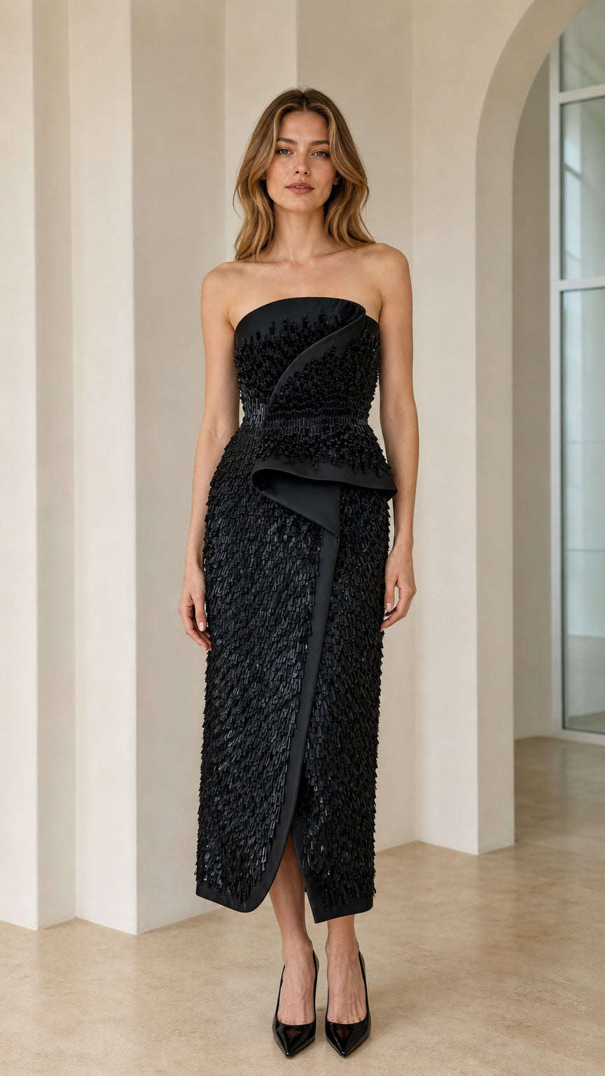 Front view of black strapless beaded peplum midi dress