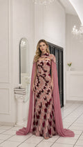Front full view of dusty pink beaded evening dress with cape