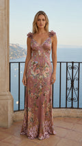 Front view of model wearing mauve floral print maxi dress with flower straps