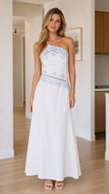 Front view of white one-shoulder embroidered maxi dress