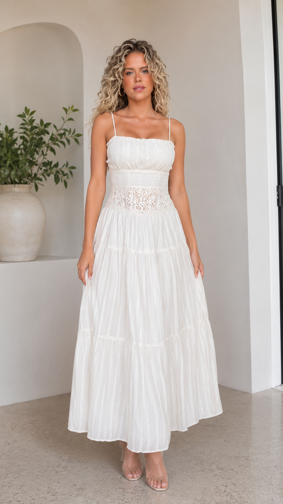 Front view of white spaghetti strap tiered maxi dress with lace-look waist detail