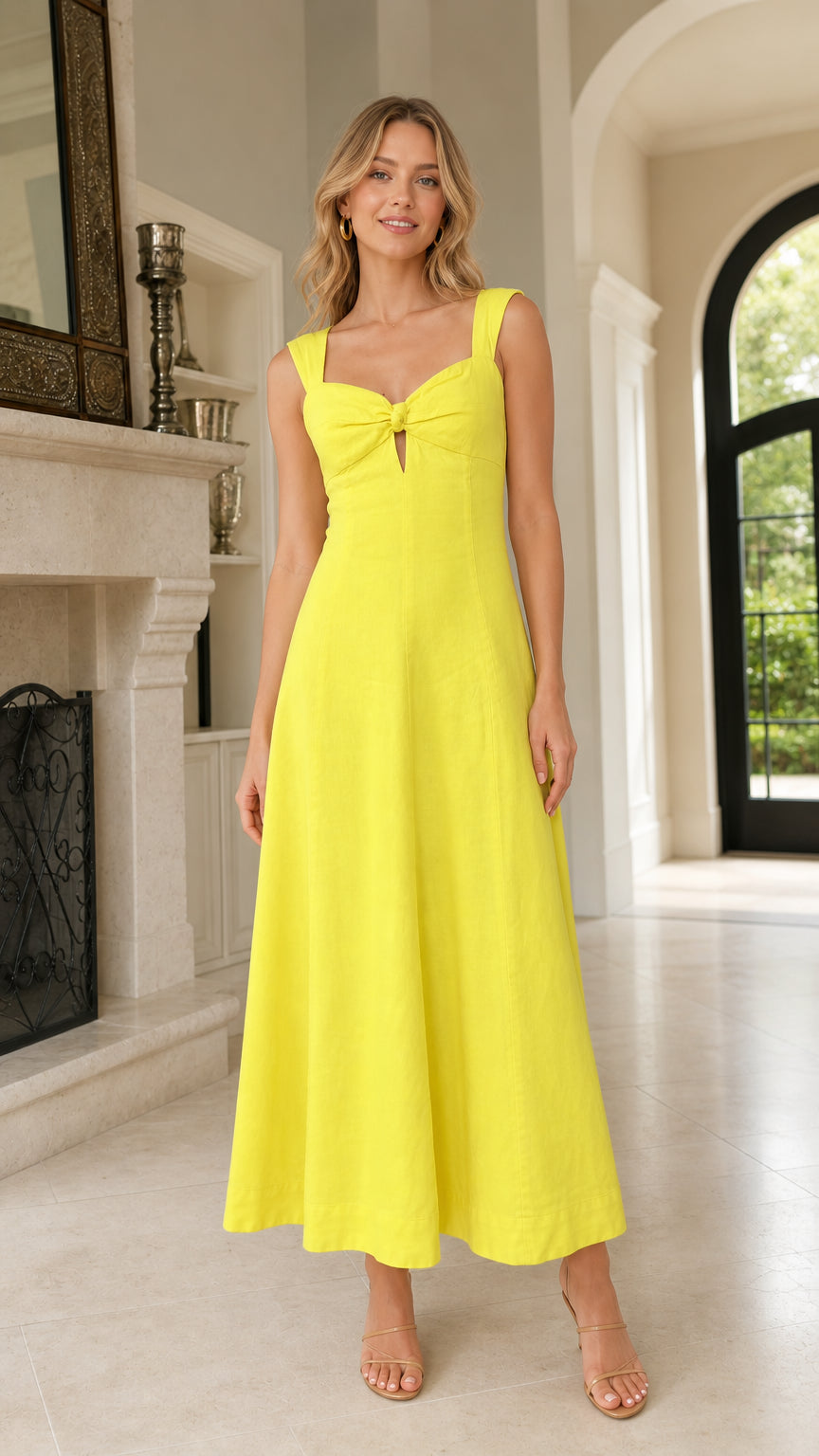 Front view of woman wearing yellow tie-front midi dress