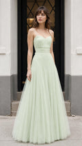 Front view of model wearing sage green tulle maxi dress
