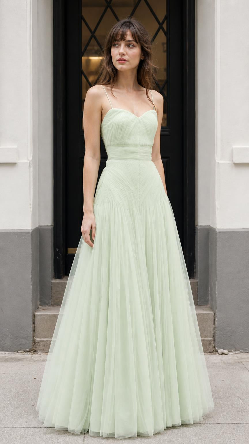 Front view of model wearing sage green tulle maxi dress