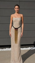 Front view of champagne strapless beaded long gown