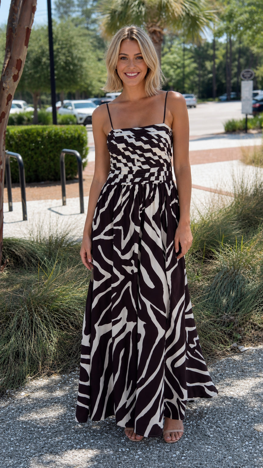 Front view of black abstract print maxi dress on model