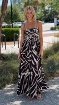 Front view of black abstract print maxi dress on model