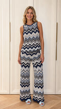 Front view of woman wearing blue chevron knit tank and wide leg pants set