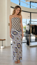 Front view of woman wearing white multi boho printed strapless maxi dress