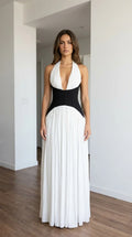 Front view of white halter pleated maxi dress