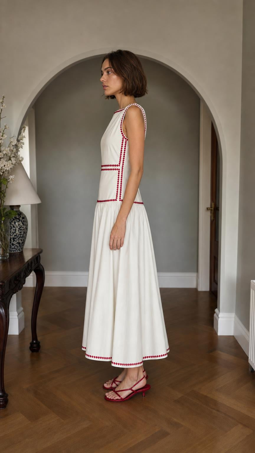 Side profile of White embroidered midi dress