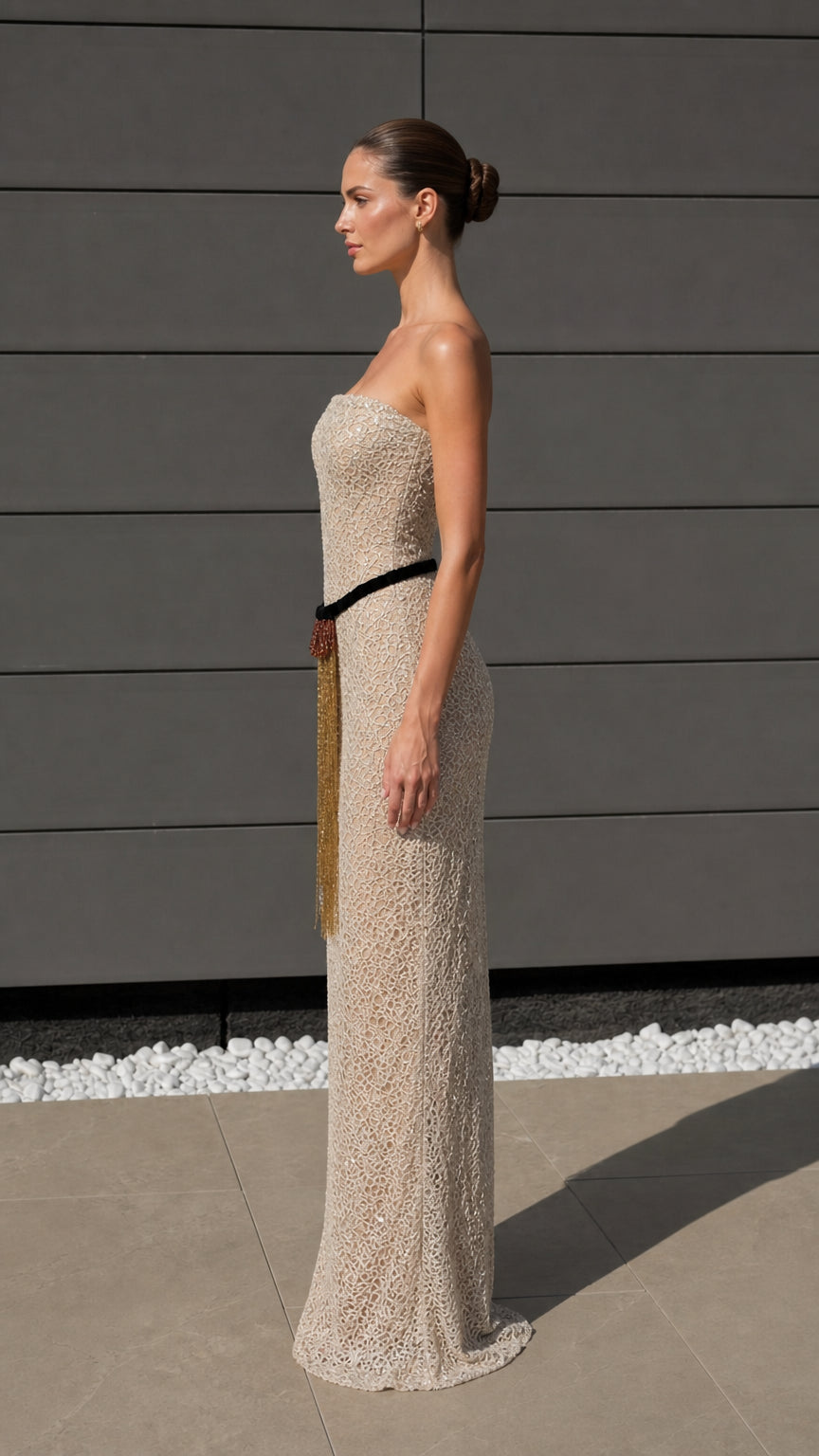 Side profile view of champagne evening gown