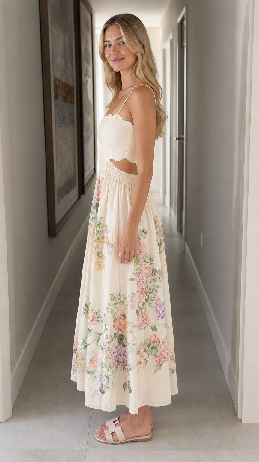 Woman wearing ivory floral cutout midi dress side view