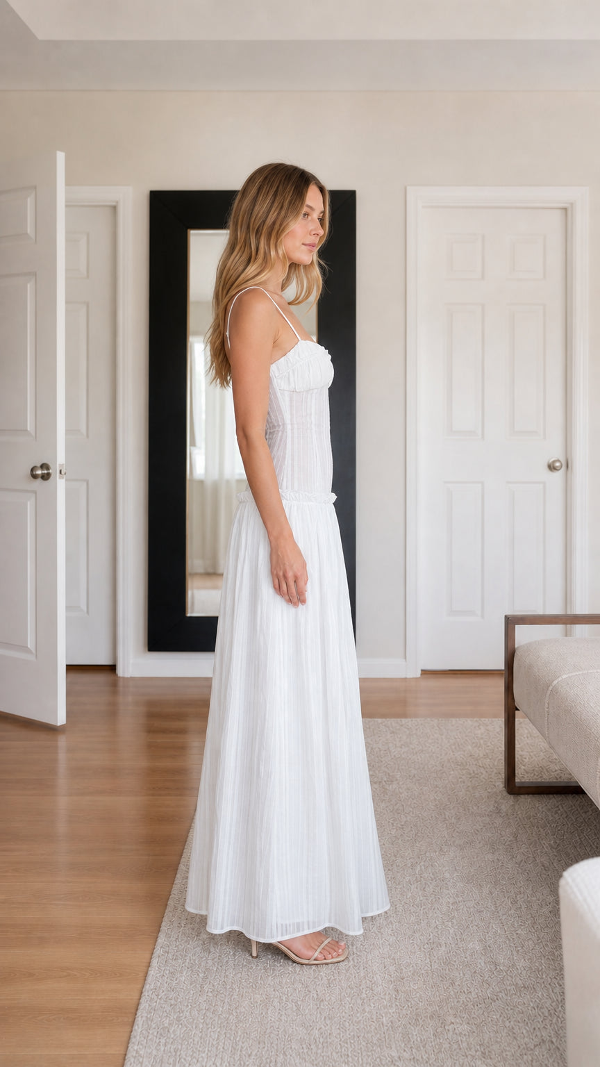 Side profile view of White pleated cami maxi dress