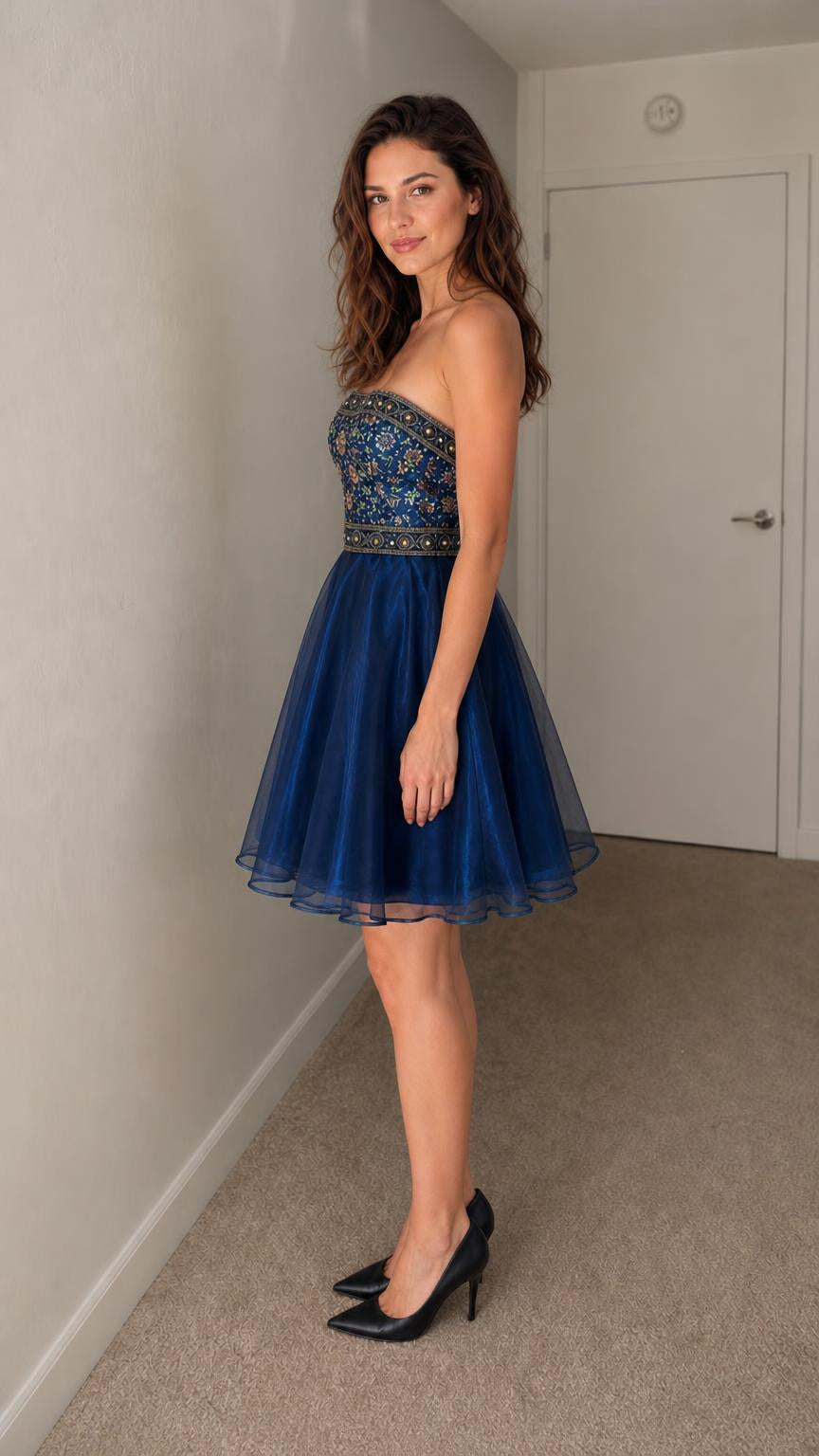 Side profile view of navy blue tulle mini dress