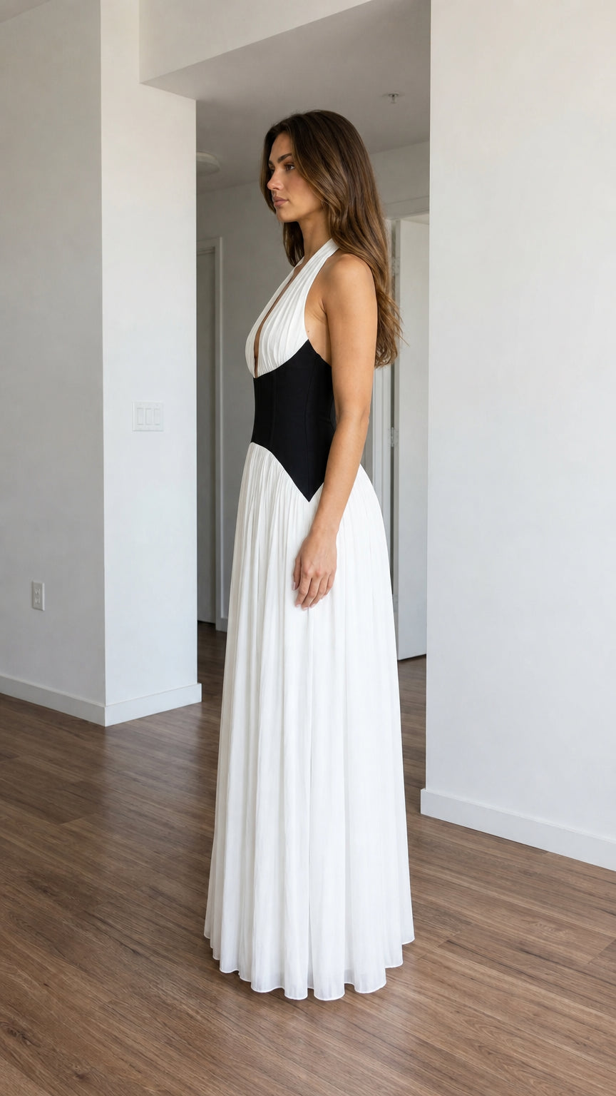 Side profile of white halter pleated maxi dress