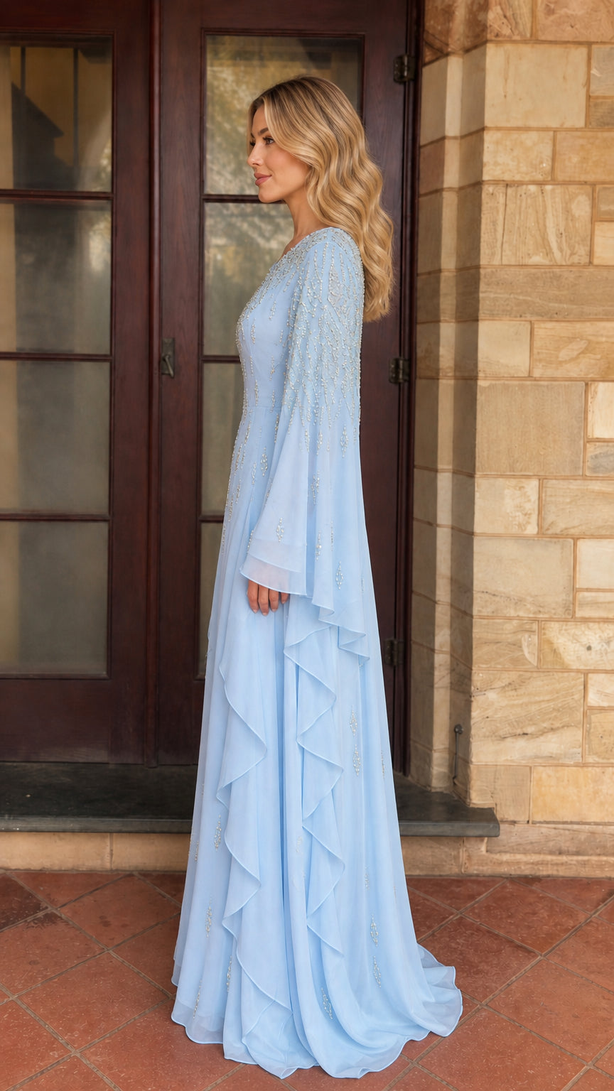 Model wearing light blue beaded maxi dress side profile view