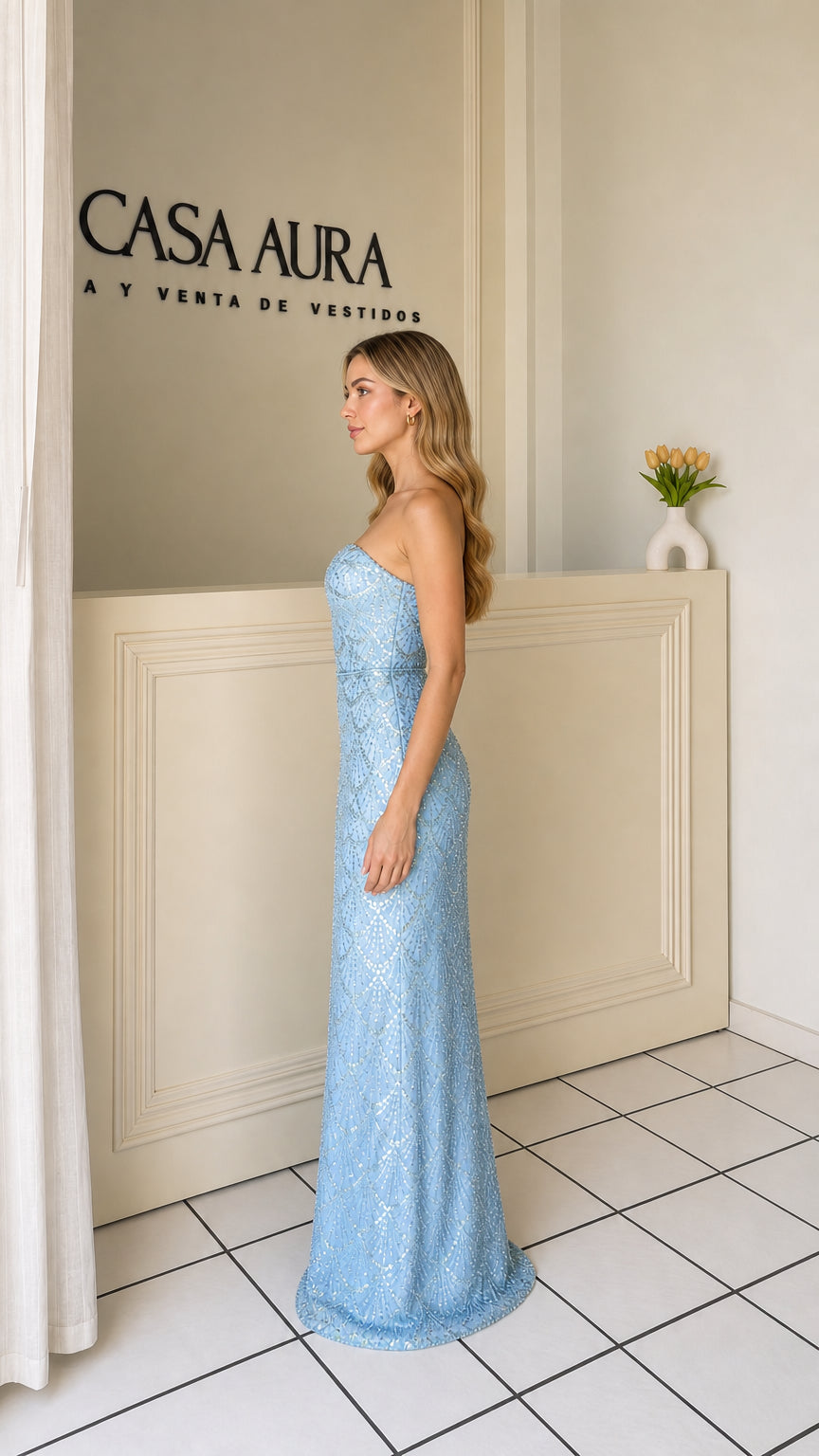 Side profile view of model in light blue sequin gown