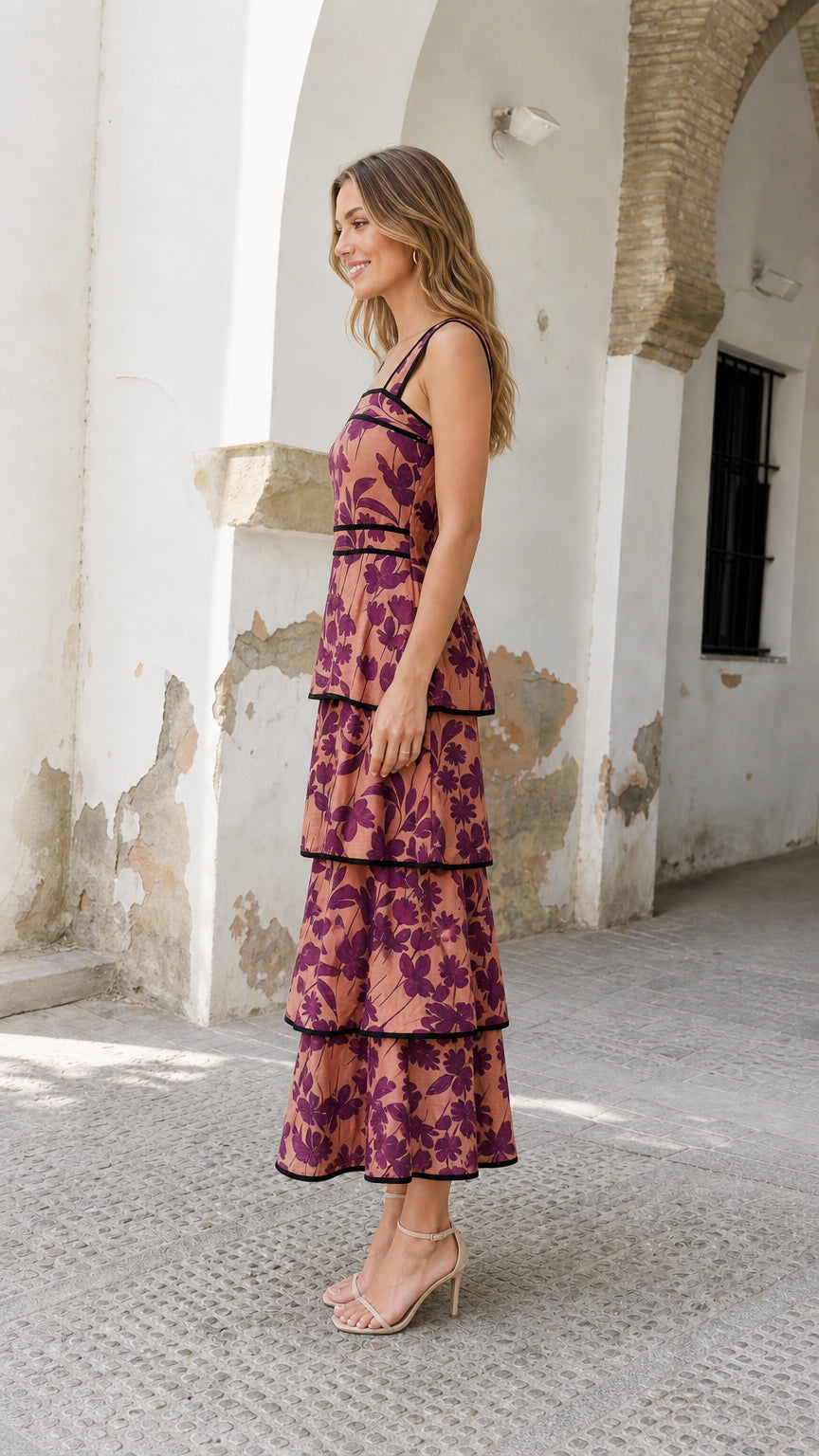 Side view of model wearing rose pink floral tiered midi dress