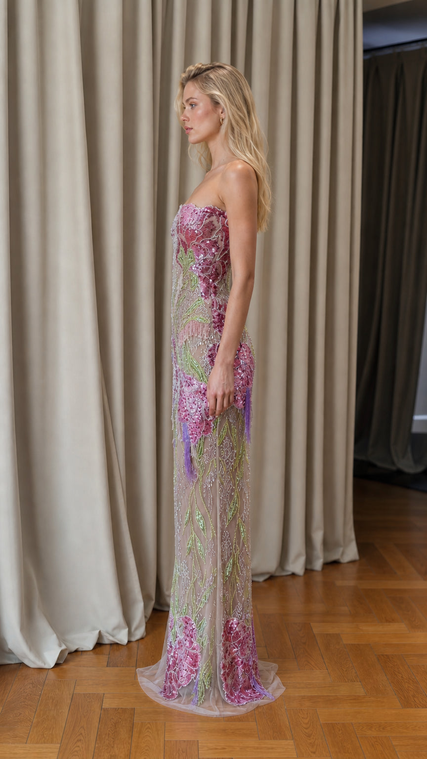 Side profile view of pink floral sequin strapless evening gown