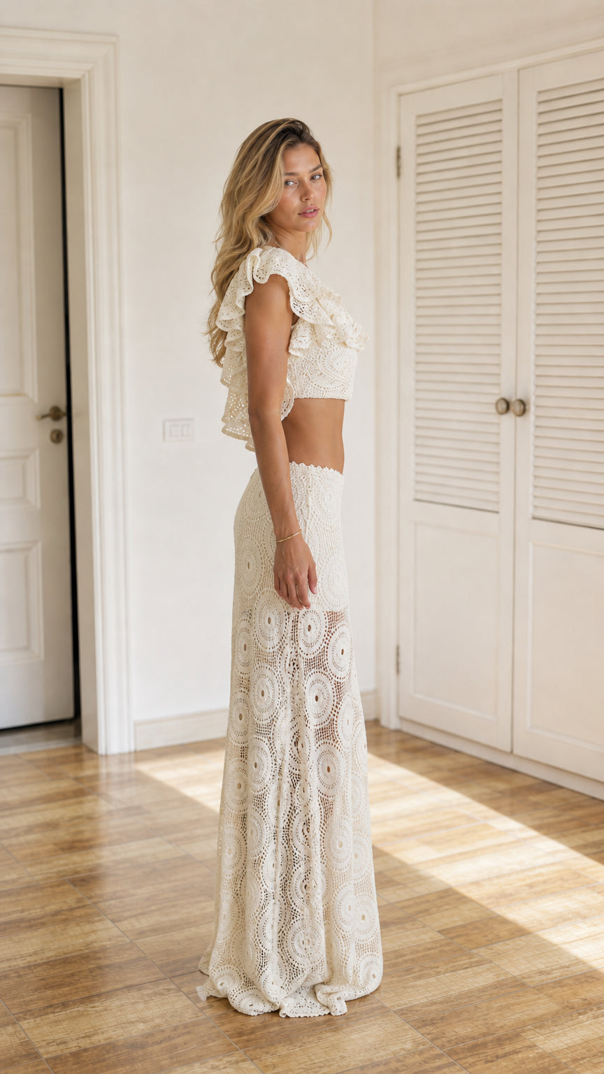 Side profile view of ivory crochet two-piece set on model