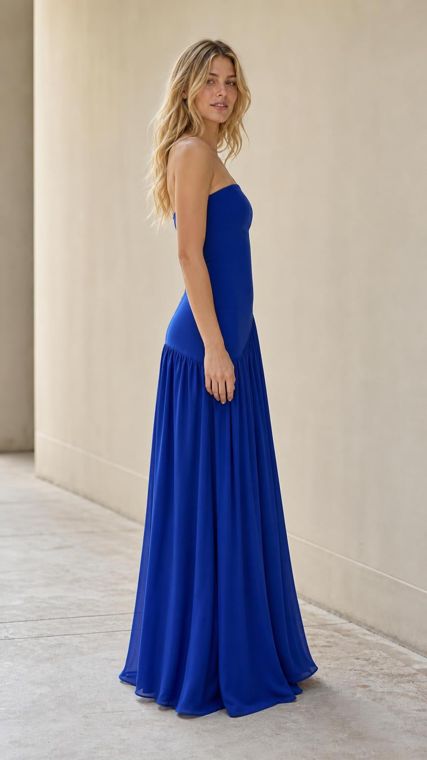 Side profile of model in royal blue formal gown