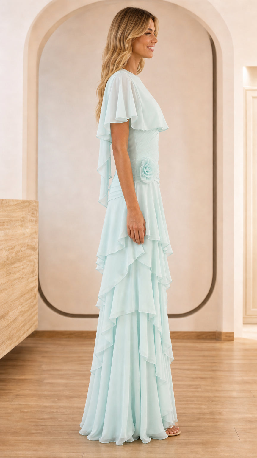Side profile of light blue evening gown with rosette accent