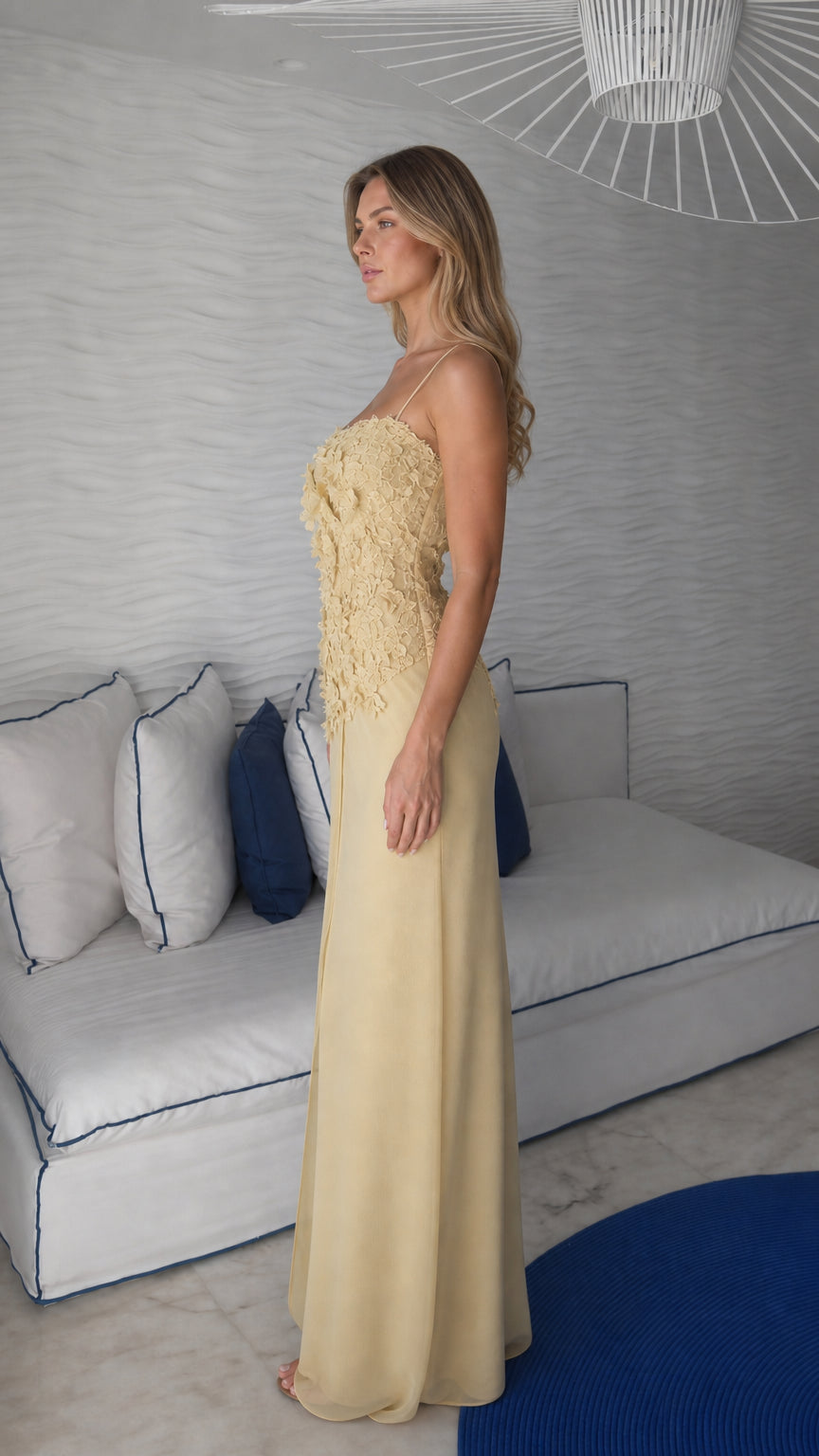 Side profile view of yellow maxi dress