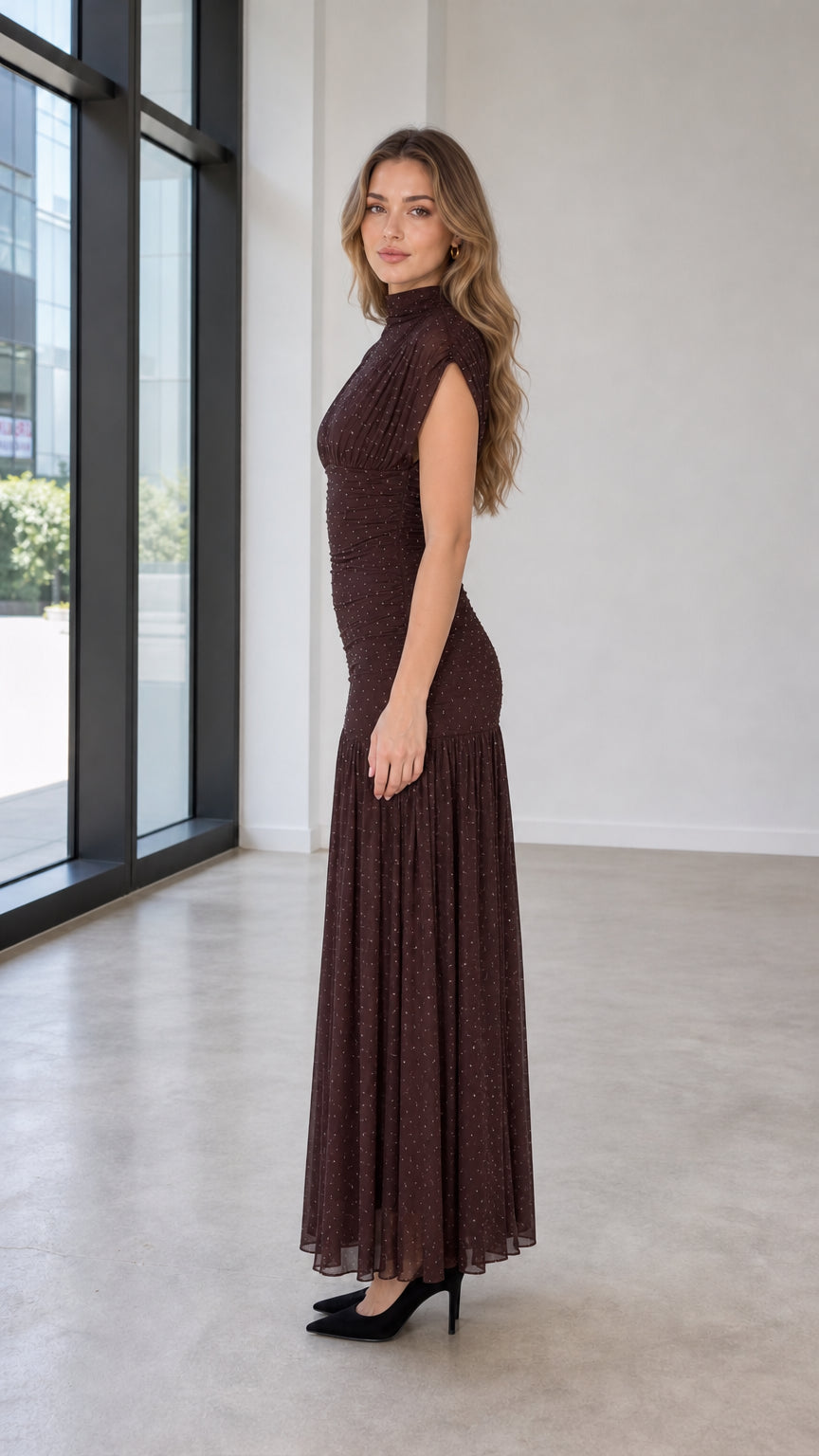 Side profile of model wearing brown glitter mesh maxi dress