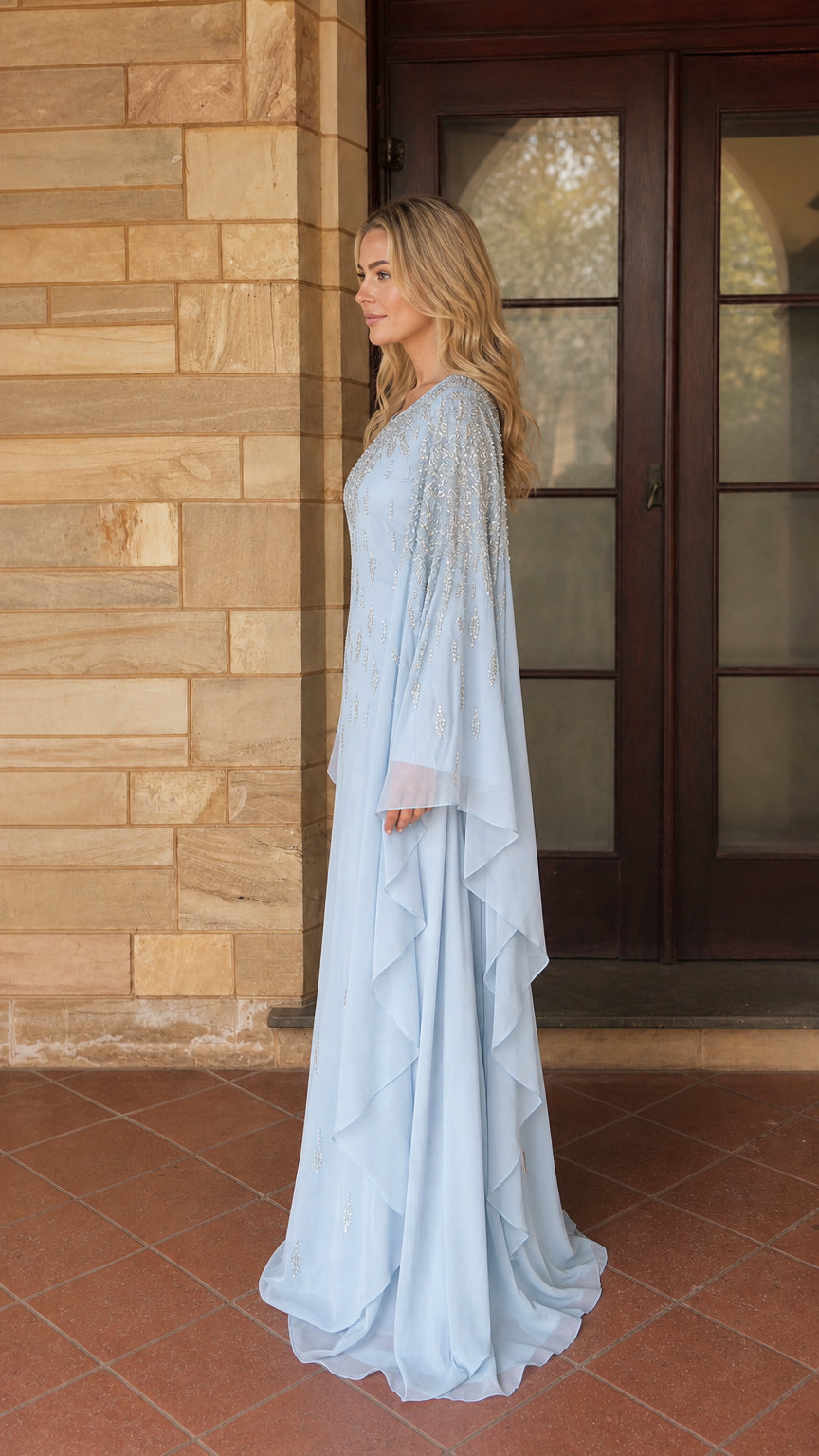 Side profile of light blue beaded kaftan maxi dress