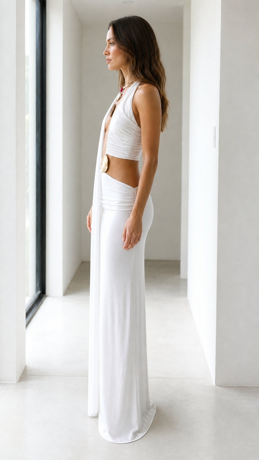 Side profile view of white drape maxi dress