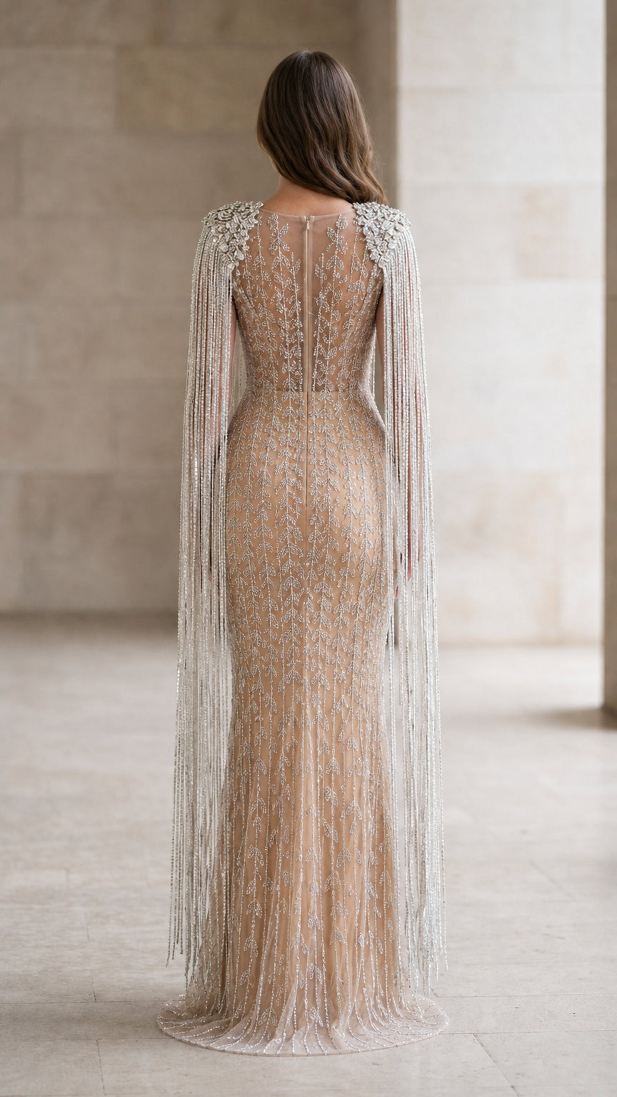 Back view showing detailed mesh and fringe cape design