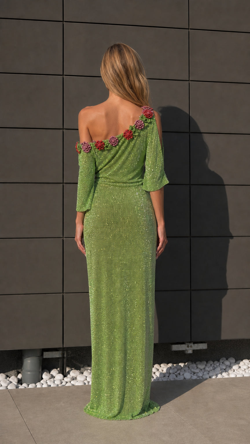 Back view of green formal gown with beaded shoulder detail