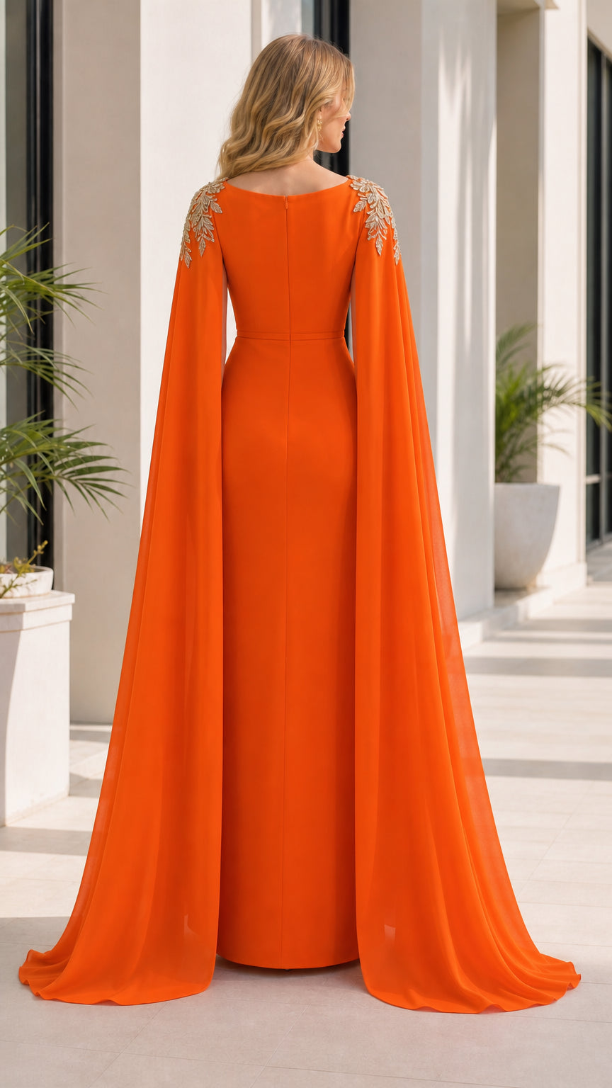 Back view of orange evening dress showing cape drape