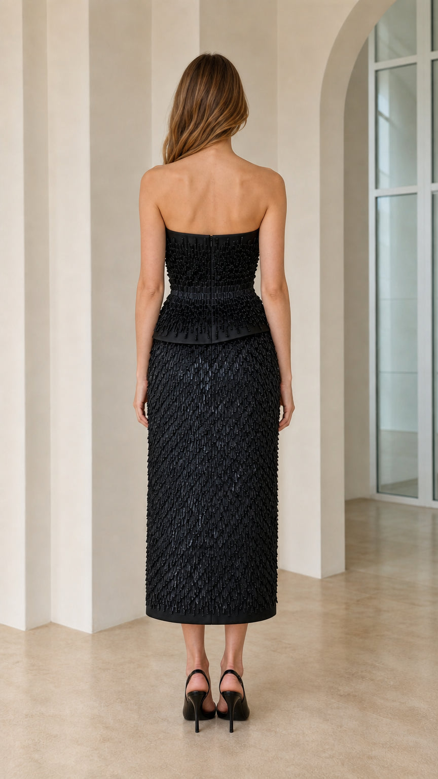 Back view of black strapless beaded midi dress