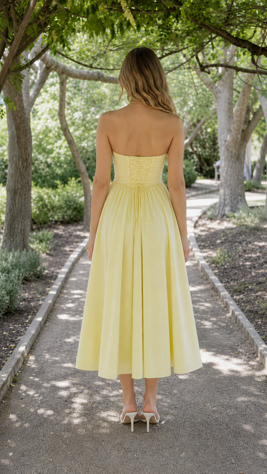 Back view showing lace-up corset detail on yellow midi dress