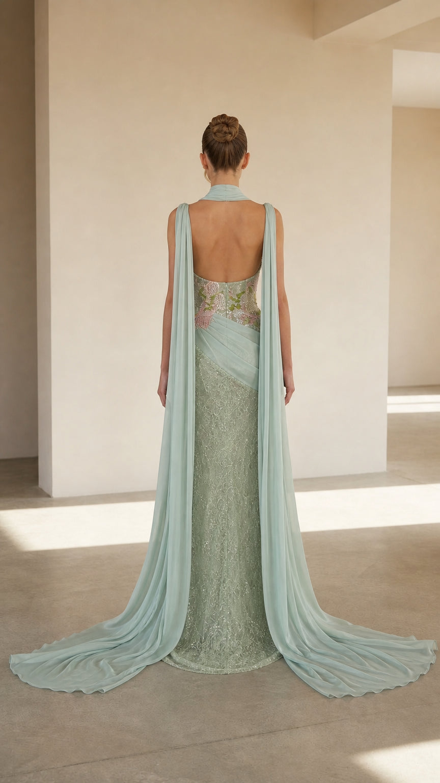 Back view of mint green formal gown with open back and long train