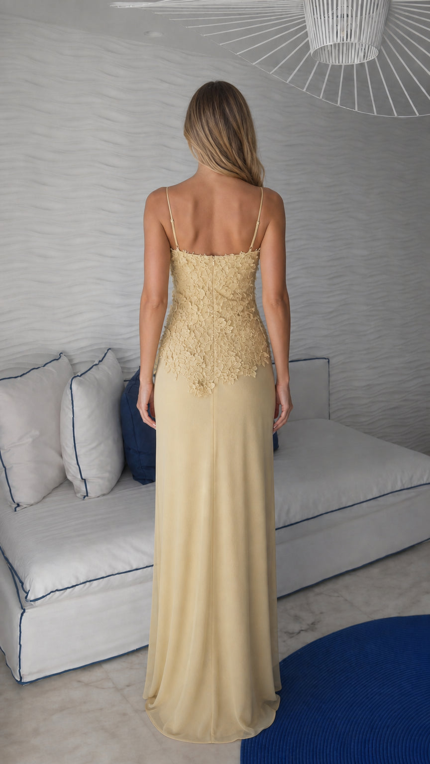 Back view of yellow spaghetti strap evening gown