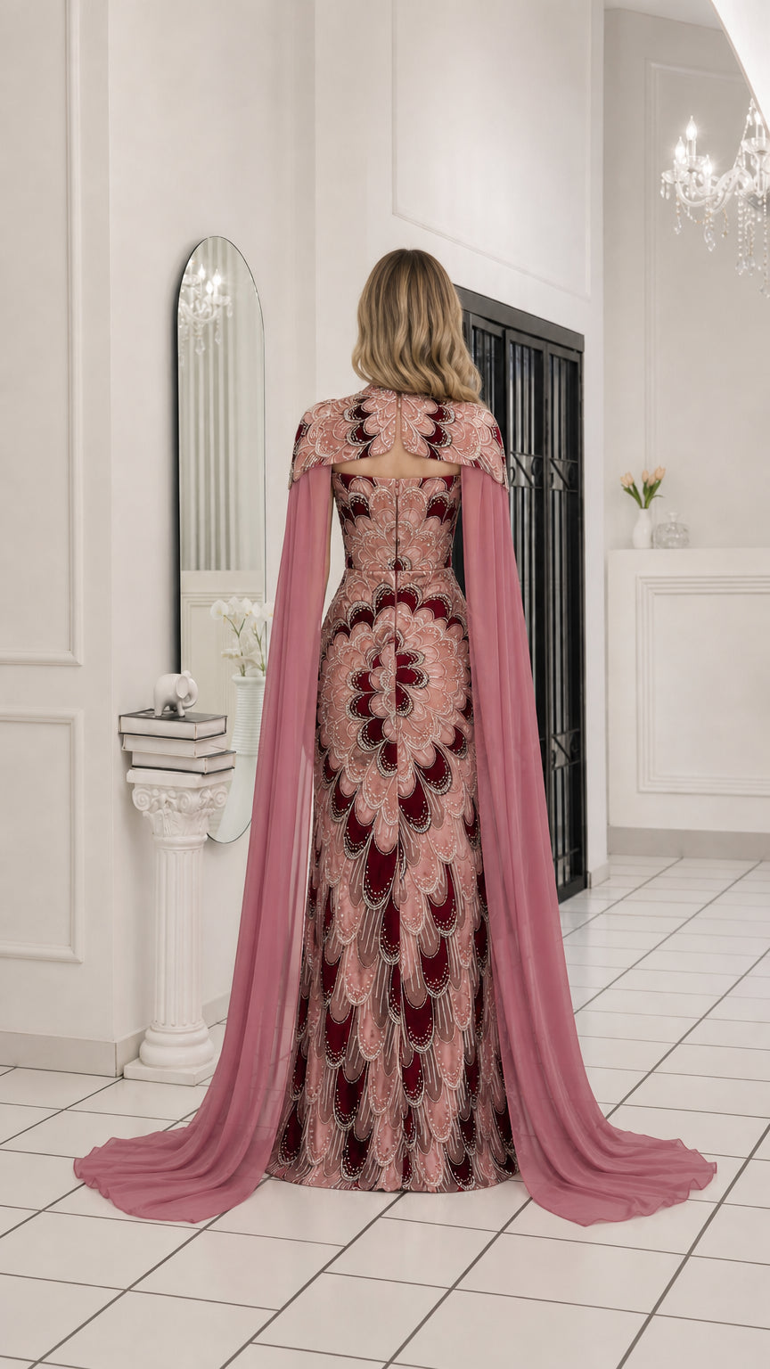 Back view showcasing the flowing cape of the evening gown