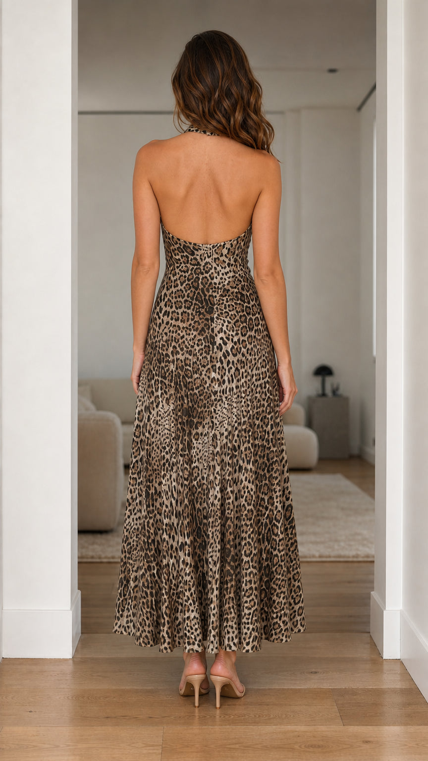 Back view of model wearing brown leopard print halter maxi dress