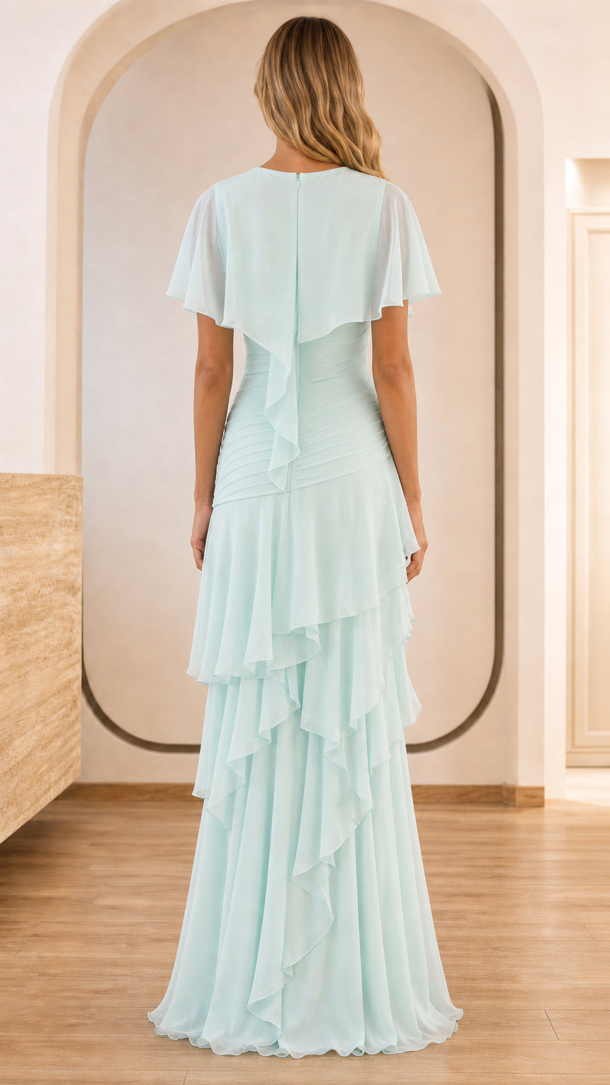 Back view of light blue formal dress with cape overlay