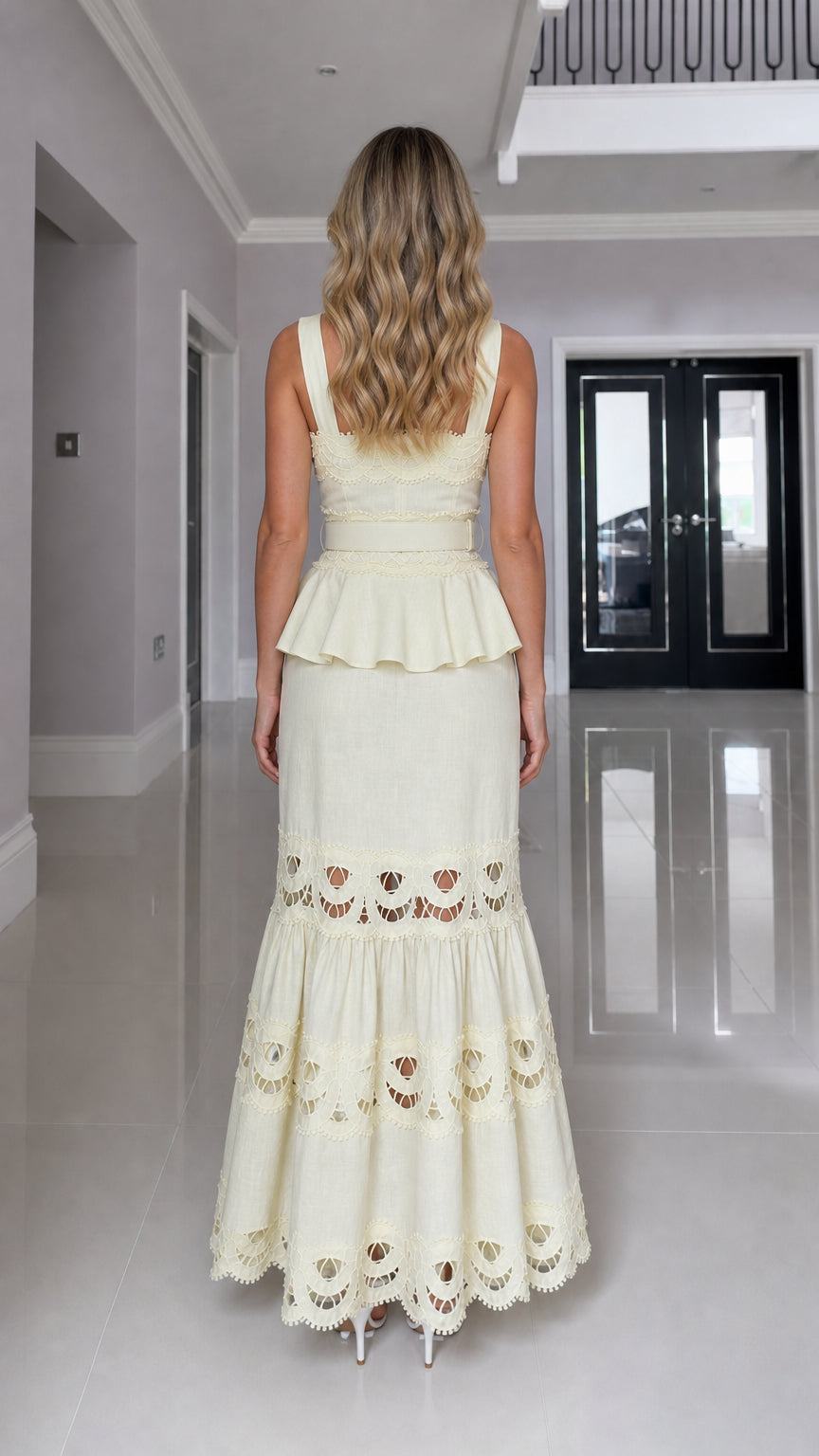 Back view of model in yellow cutout maxi dress