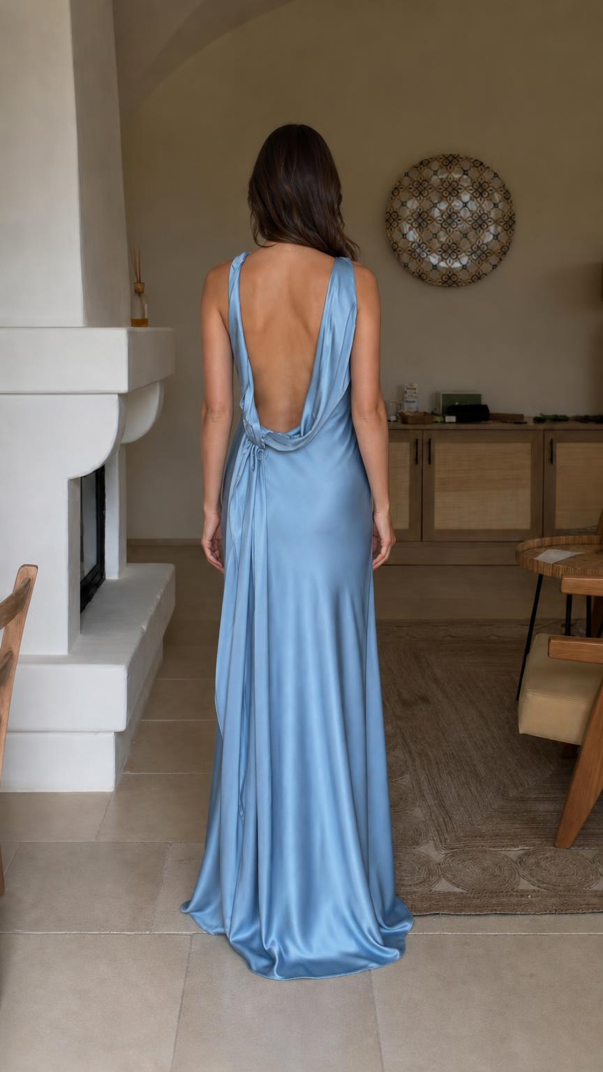 Back view showcasing open back detail of light blue satin dress