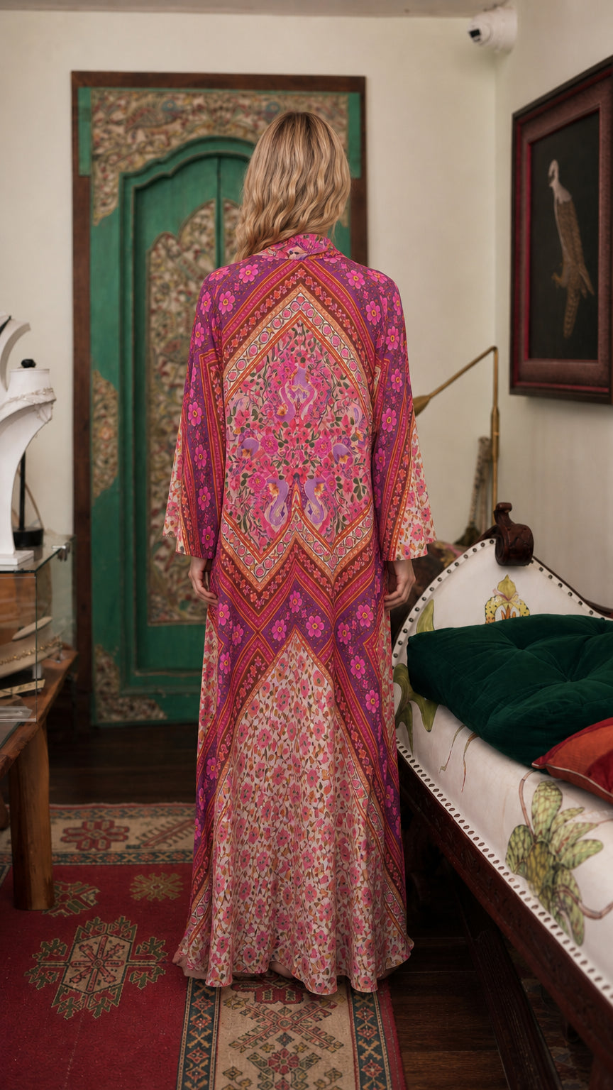 Model wearing pink bohemian floral maxi dress back view