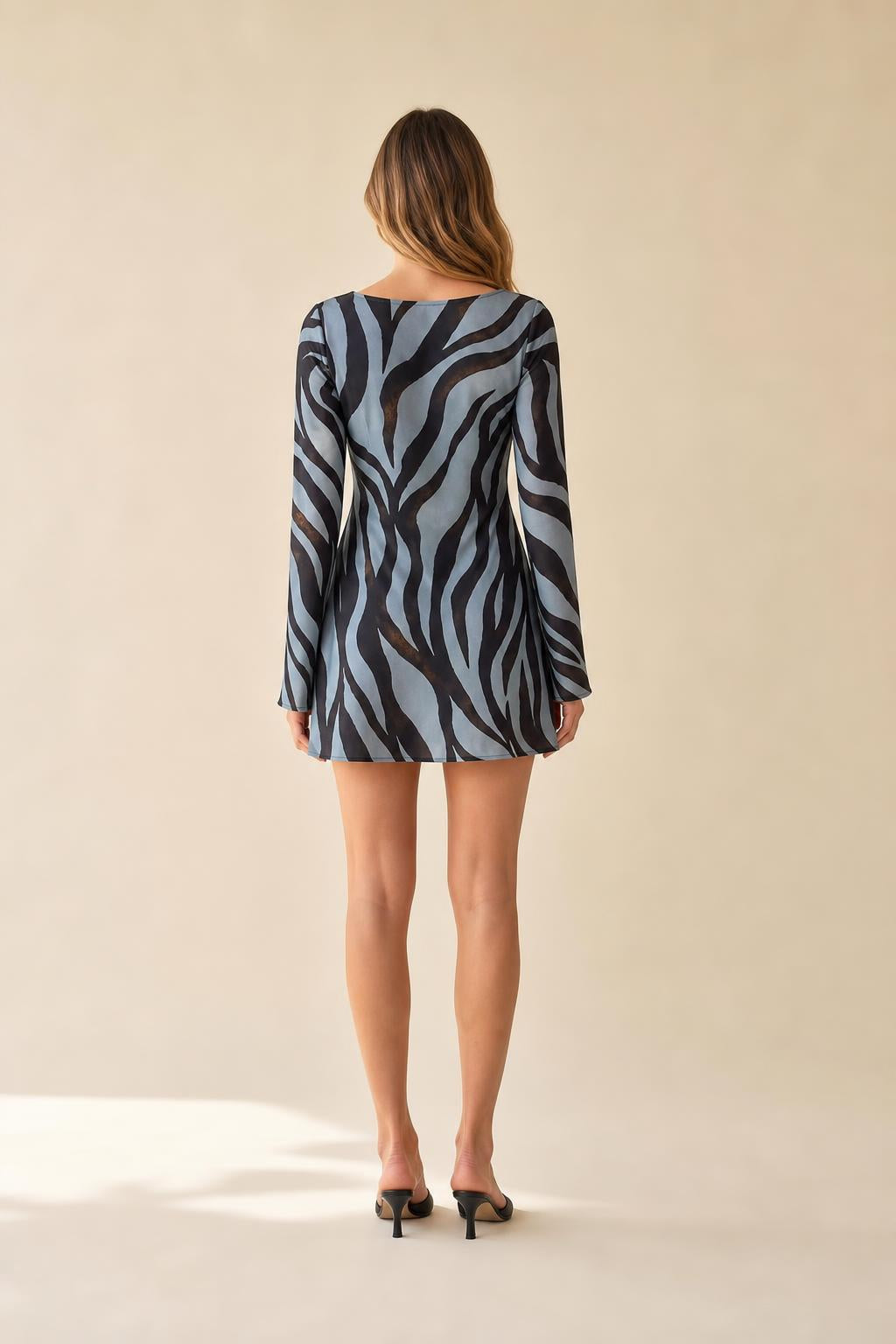 Back view of model showcasing mini dress length and fit